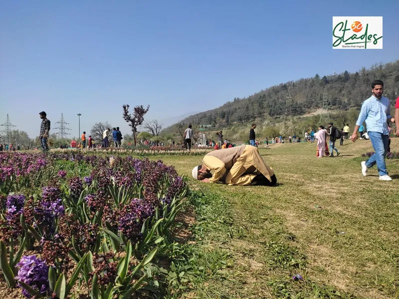 A visitor offers the Namaz while on a visit to the Tulip Garden. Pic: Parsa Mahjoob 30stades