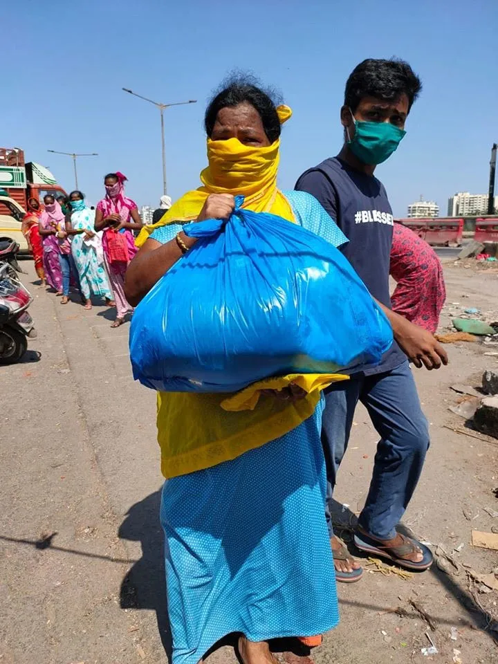 A woman in Dharavi after collecting ration from NGO Dharavi Diary. Beginning December 25, no new case has been reported from Dharavi, Asia's largest slum, which was one of the worst affected by COVID-19. Pic: Dharavi Diary