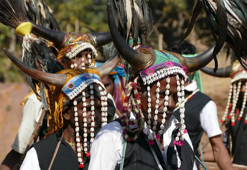 The headdress is decorated with feathers and stringed cowrie shells, which almost cover the face of men. Pic: Flickr