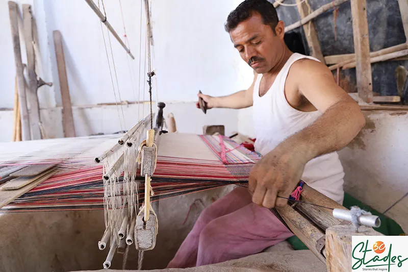 Shamji Valji weaving on his pit loom in Bhujodi. Pic: courtesy of Shamji Valji