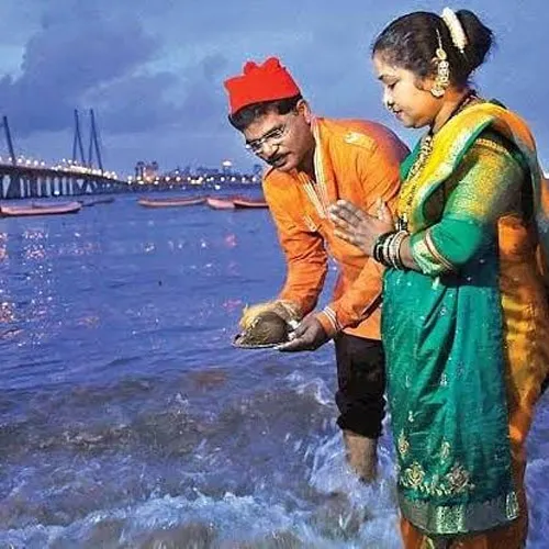 A Koli couple offering coconut to the sea on Narial Poornima. Pic: Flickr
