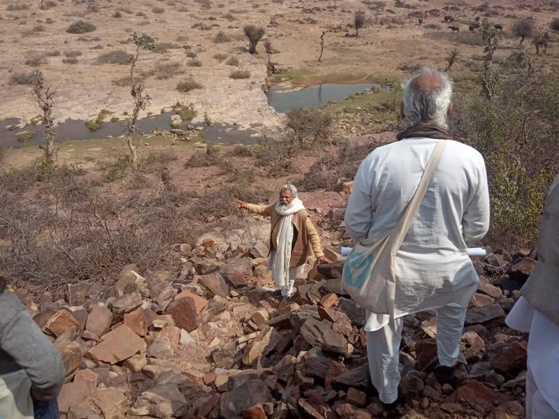 TBS Founder Rajendra Singh with his team surveying an area for water conservation. Pic: Facebook/@jalpurush