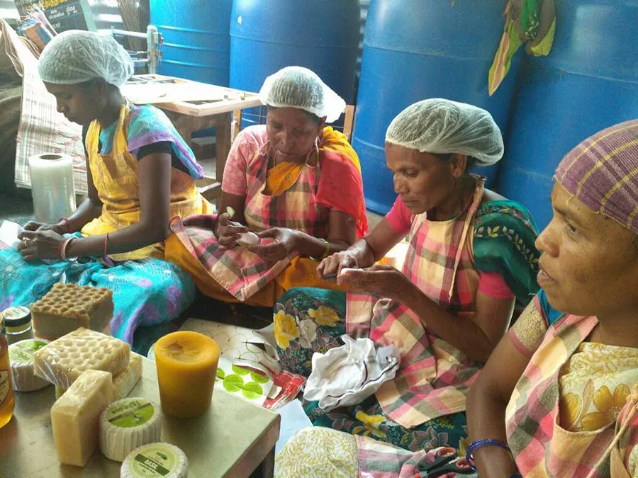 Tribal women making products from beeswax at an Aadhimalai processing centre in the Nilgiris. Pic:  AAPCL  30stades