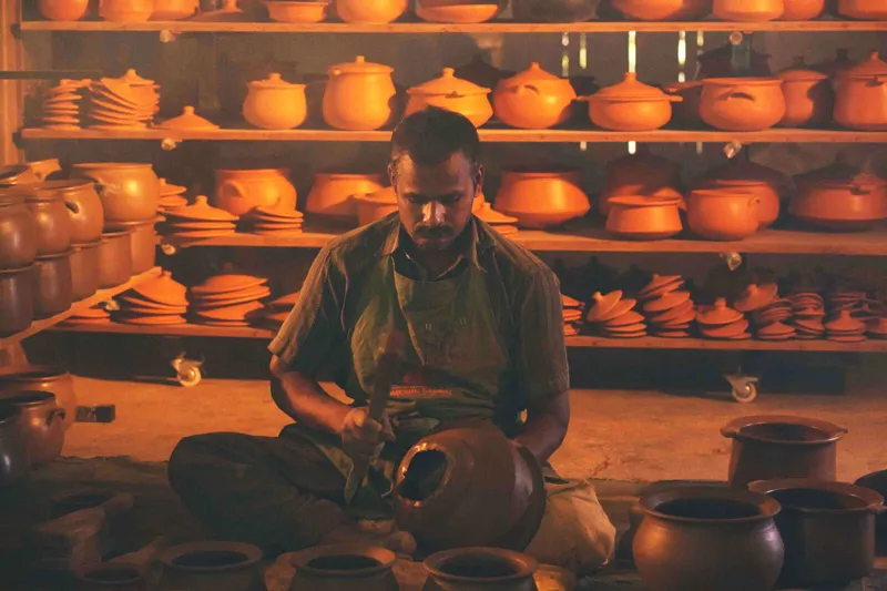 An artisan at the Earthen Browns unit is using the 'beating' technique to strengthen the bottom of the utensil. Pic: Earthen Browns 30stades