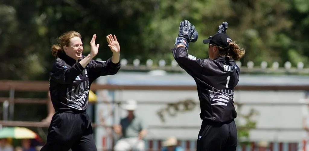 Clare Nicholson (L) and Rebecca Rolls celebrate the fall of a wicket. © Getty Images