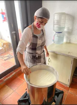 Team member Mumtaz cutting the curds during cheese making. Pic: Kase Cheese 30stades