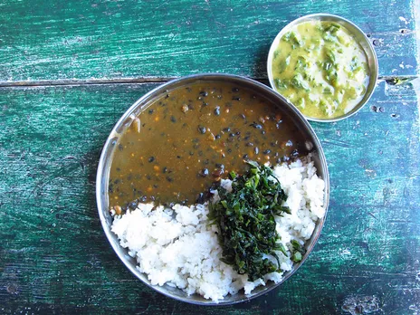 Bhatt ki dal (black soybeans), rice and greens served for lunch. Pic: Flickr 30 stades