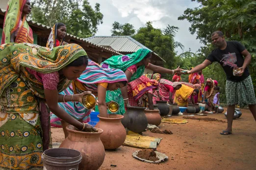 Tribal women farmers in West Bengal treating the stored seeds before sowing. Pic: Pradan 30stades