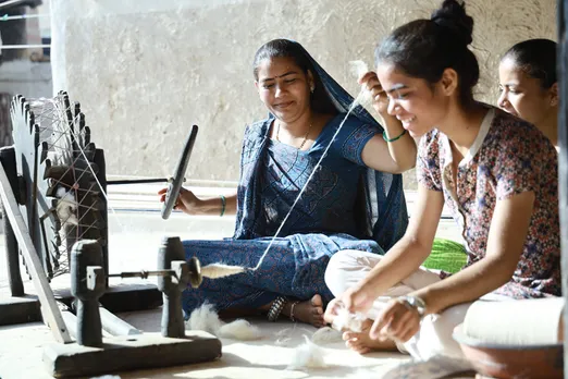 Women and youngsters of the house often participate in spinning.   Pic: Shamji Valji  30 stades