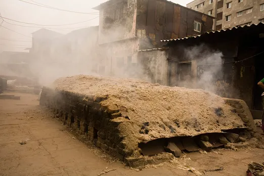 The kiln is covered with cow dung, soil etc to maintain temperature