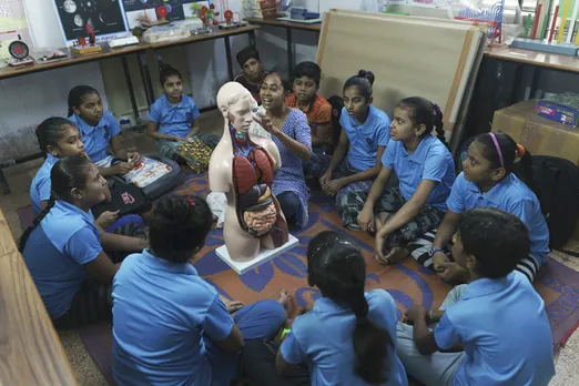 Facilitating STEM education - a teacher explaining body parts to children. Pic: Saath 30stades