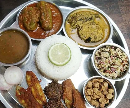 Mithila thali includes kumhrauri, raw banana and other vegetable fritters, stuffed parwal, bhoonja (dry vegetable).