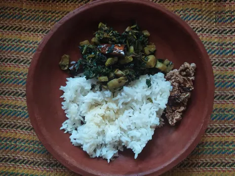 Sweet potato leaves sautéed with garlic, bottle gourd and dried red chilli, served with rice and chutney. Pic: Facebook/@ForgottenGreens 30stades