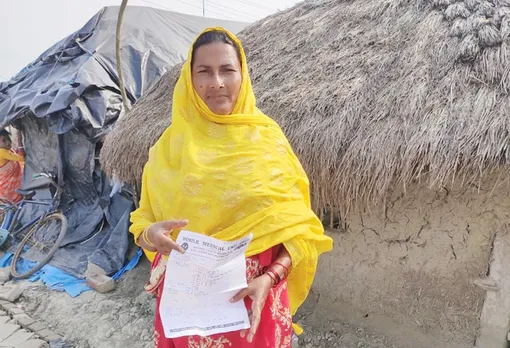 Marzini Bibi, 48, showing her report. She has been consulting the doctors at mobile medical services for the last 4 years. Pic: Courtesy SHIS 30 STADES