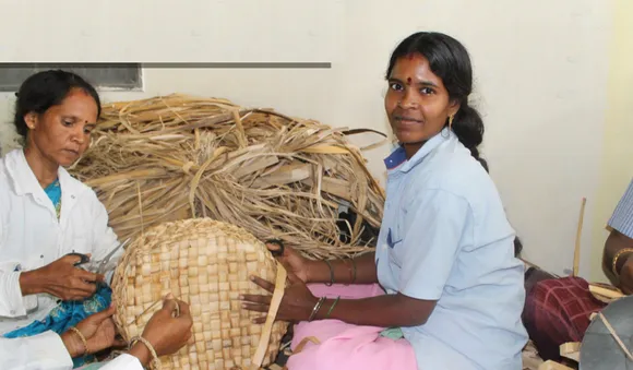 Women weaving banana bark baskets