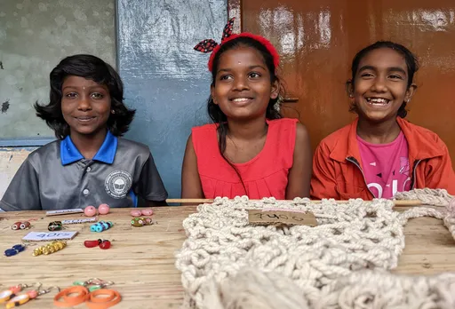 A group of 13-year-olds, Navya, Muskan and Chaitra, are all smiles as they have complete a project on Macramé home décor. Pic: Project DEFY 30STADES