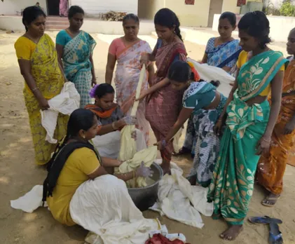 Fabric being dipped in a mix of milk and myrobalan. It will be dried in sun before sketching is done. Pic: Dwaraka 30stades