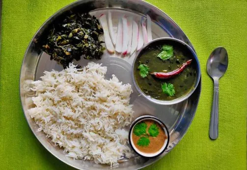 Bhatt  (black soybeans) ki chudkani is made by blending the beans with a paste of rice. Served here with rice, thechwani, mountain radish and greens. Pic: Flickr  30 stades