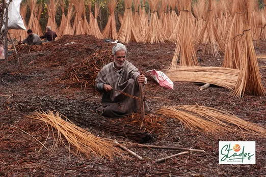 An artisan using the zealan, a Y-shaped stick, to remove the bark from willow stem. Pic: Wasim Nabi