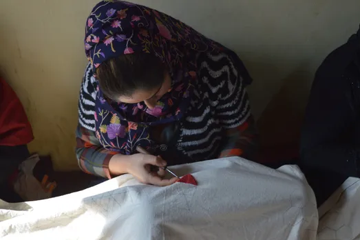An Kashmiri artisan engrossed in Aari embroidery. Pic: Rangsutra 30stades