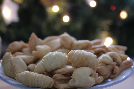 Kulkuls are deep-fried snack with textured ridged edges that look like shells. They are made with flour, ghee, sugar, eggs, semolina and coconut milk. Pic: Flickr