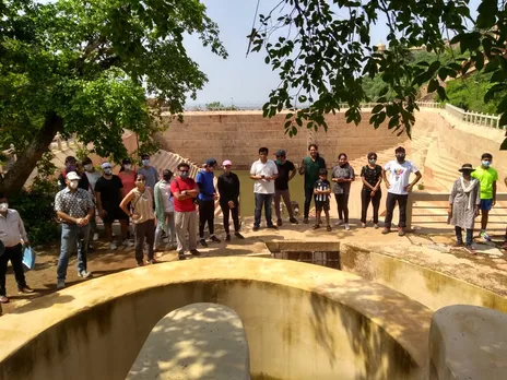 Participants at the Nahargarh Fort heritage walk learning about the complex water harvesting mechanism.
