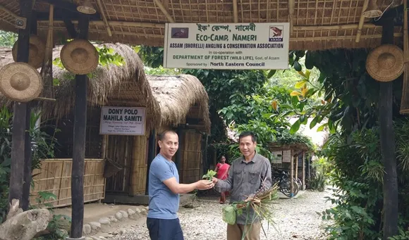 Samir Bordoloi receiving an indigenous plant from a villager. Pic: Facebook/@SamirBordoloi