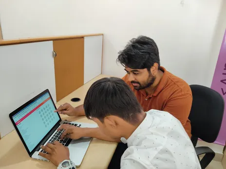 HashHackCode founder Manu Sekar with a student. Pic: through  HashHackCode 30 stades