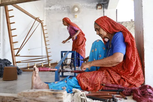 After dyeing, the yarn is dried in the sun. The yarn for the weft (bano) is filled in bobbins using the charkha.   Pic: Shamji Valji 30 stades