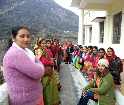 Poonam Rawat-Hahne (seated, front), founder,  Fernweh Fair Travel, with women from neighbouring villages.