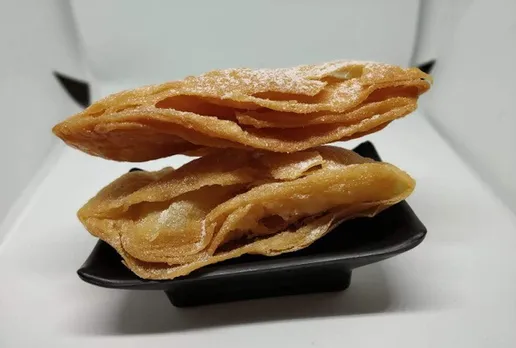 Khaja -- thin layered fritters soaked in sugar syrup.  Khaja from Silao in Nalanda is the most famous. 