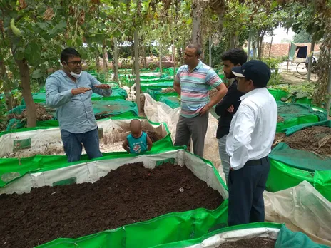 Mukesh Pandey (in blue) at his vermicomposting facility. Pic: Nav Chetna Agro 30stades