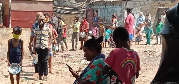 Those in slums were the worst affected as social distancing was impossible, they lost their jobs and had to queue up for every meal. Pic: CRISIL