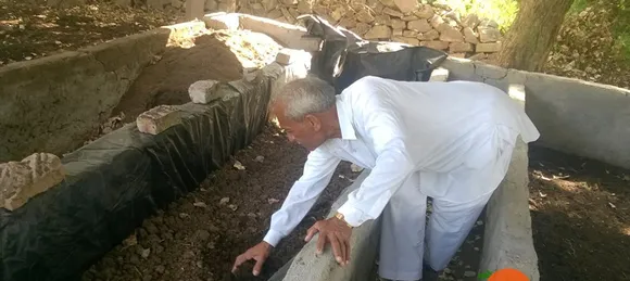 Hukumchand Patidar inspecting organic manure on his farm. Pic: Facebook/@organicamrit 