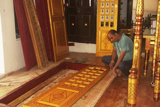 An artisan working at Nilesh Kharadi's unit. He is making Sankheda doors in golden and maroon colours, which are considered auspicious. Pic: Aruna Raghuram 30stades