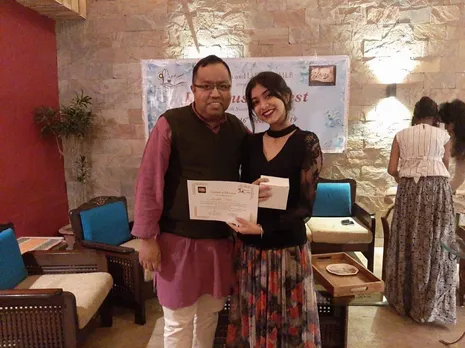 Abhijit's student Anushka Basu receives the best actress award in 2019 during Bhopal's Jane Austen Fest for playing the role of Emma Knightely. Pic: courtesy Abhijit C Chandra 30 stades