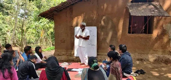 Debal Deb addressing student visitors at his Basudha rice seed conservation farm in southern Odisha. Pic: Debal Deb 30stades